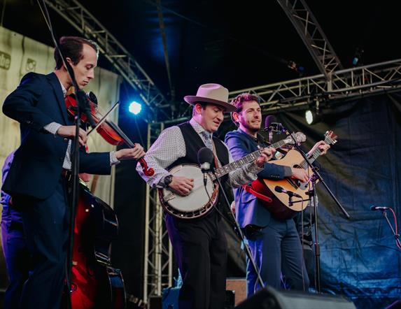 three musicians onstage at bluegrass omagh 2022