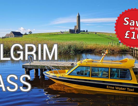 Yellow Water Taxi moored at the jetty with Devenish Tower in the background