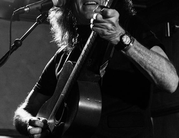 Pat McManus playing the guitar.