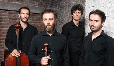 Four members of Quaturo Belo shown with their string instruments