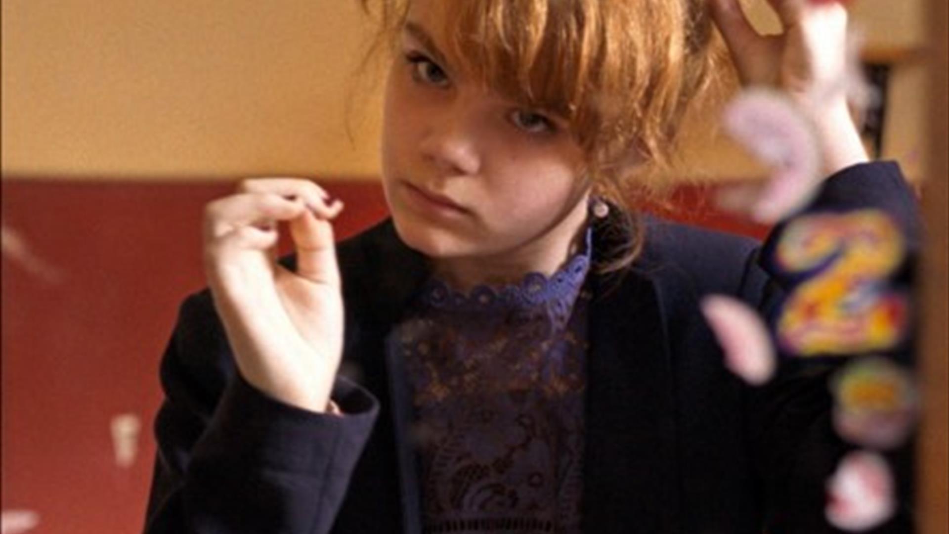 Young Girl doing her hair