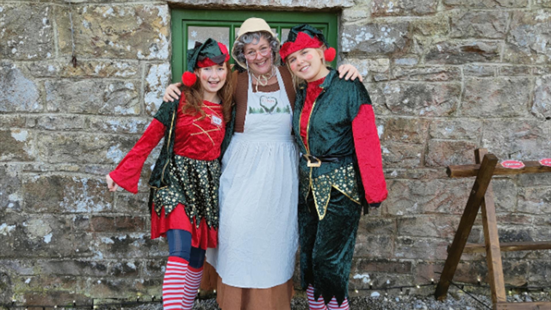 Mrs Claus welcomes families into her cosy Christmas cottage, surrounded by twinkling lights and festive decorations. Children listen to her heartwarmi