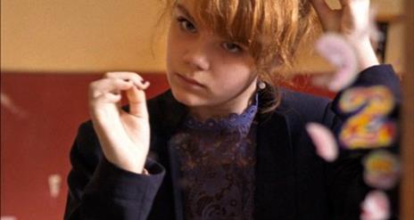 Young Girl doing her hair