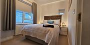 Master bedroom with mood lighting around headboards