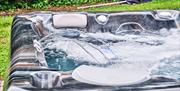 Photograph of the hot tub with bubbling water