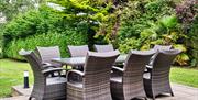 Photograph of outdoor seating area with 8 chairs