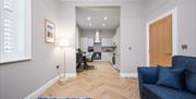 Image of open plan kitchen diner and sofa in Apartment 1 Northern Bank House