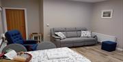 Living Room - Comfortably seats 4 (3 seater reclining sofa and armchair with footstool