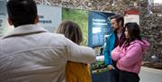 Group reads information about the marble arch caves