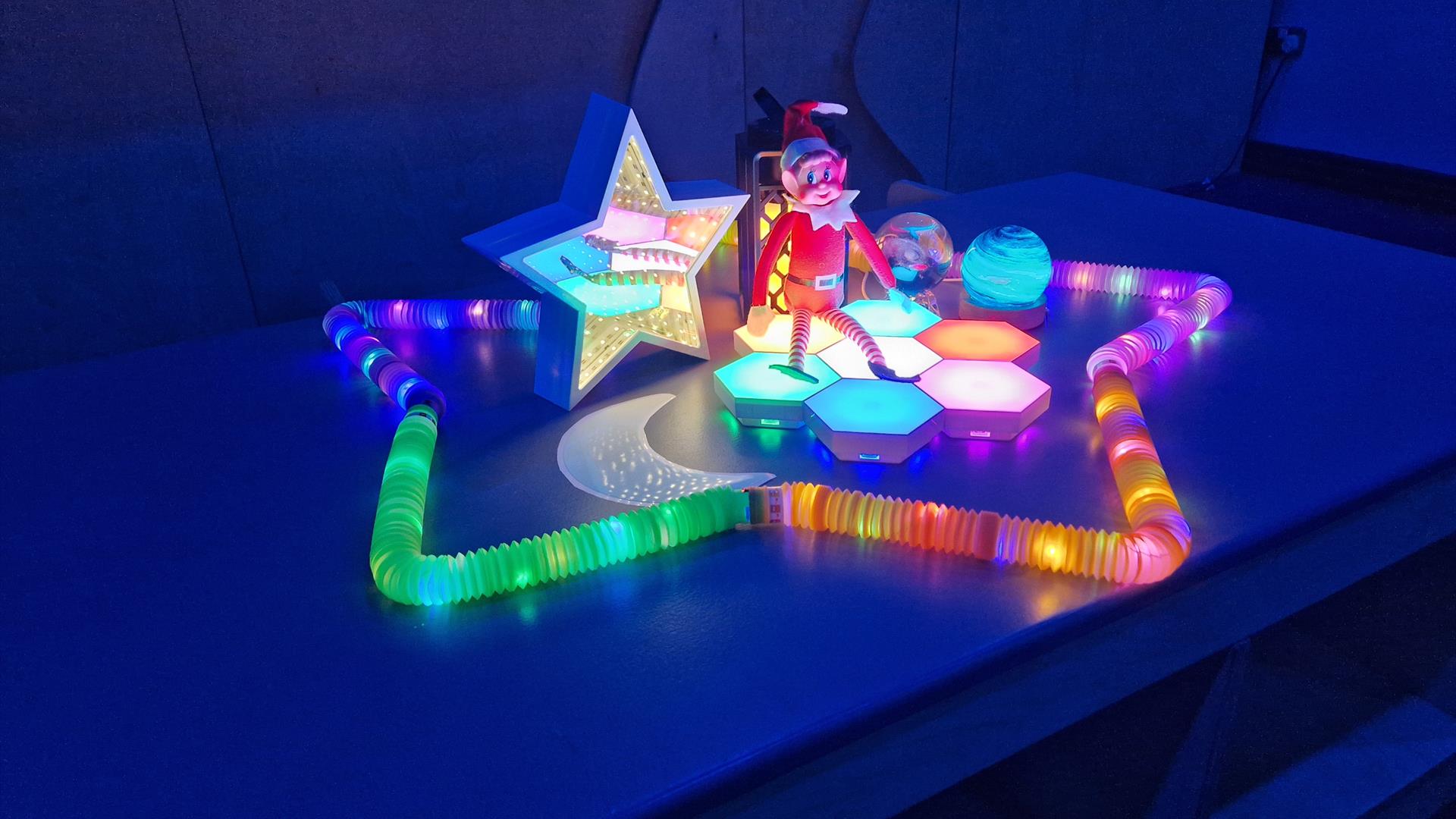 A sensory room with fun interactive trail with Christmas elves and fun stations