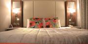 Double bed with bedside lockers and lamps